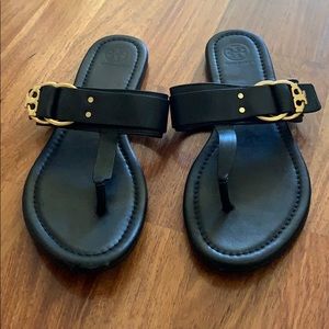 Black Tory Burch sandals with gold trim